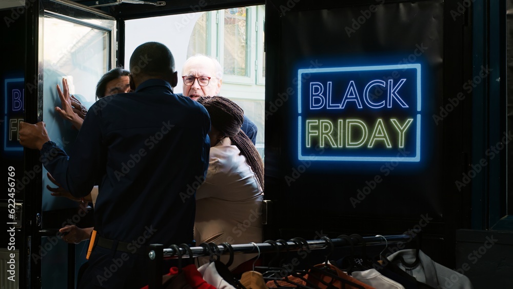 Diverse people demanding store access on black friday, trying to get inside of fashion boutique before opening hours. Anxious mad crowd fighting and arguing with security guard at entrance. Diverse people demanding store access on black friday, trying to get inside of fashion boutique before opening hours. Anxious mad crowd fighting and arguing with security guard at entrance.