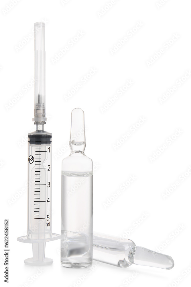Medical ampules with syringe on white background Medical ampules with syringe on white background
