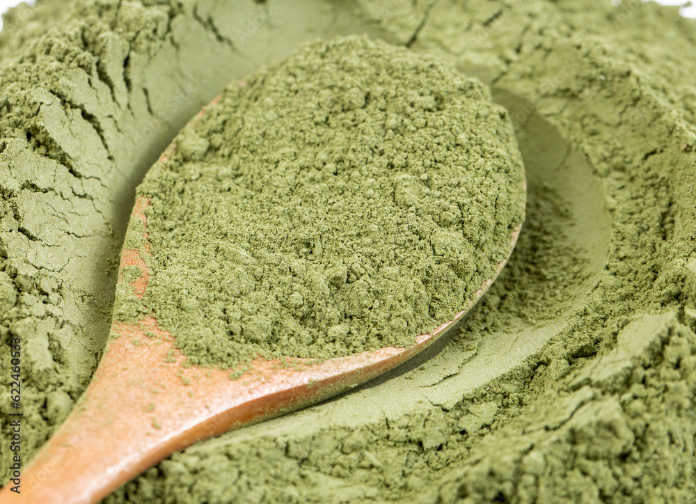 Obraz premium Heap of green henna powder isolated on white background