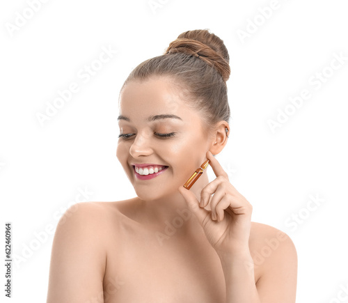 Beautiful young woman with ampule on white background. Skin care concept