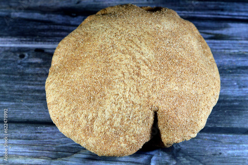 Egyptian brown bran thin crispbread bread, puff thin, crispy and delicious, eaten alone or with anything, brown circular, crunch and round baked bran whole grain breads, selective focus