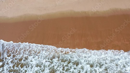 New Zealand beach with gentle waves crashing over golden sands, relaxing and calming