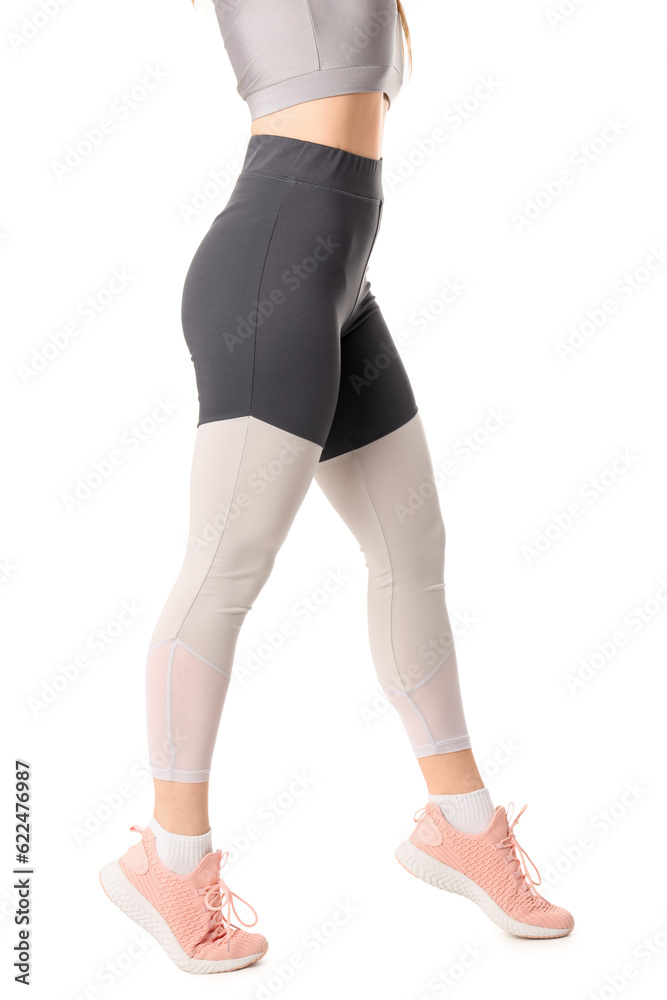 Sporty young woman in leggings on white background Sporty young woman in leggings on white background