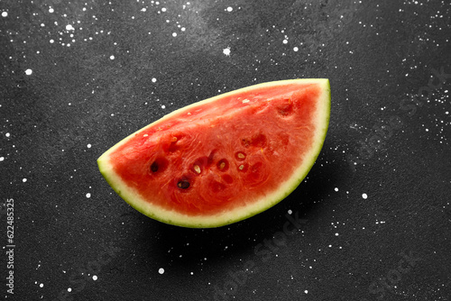 Piece of fresh watermelon on black background
