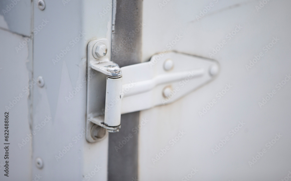 Old white door handle on a white background. Close-up. Old white door handle on a white background. Close-up.