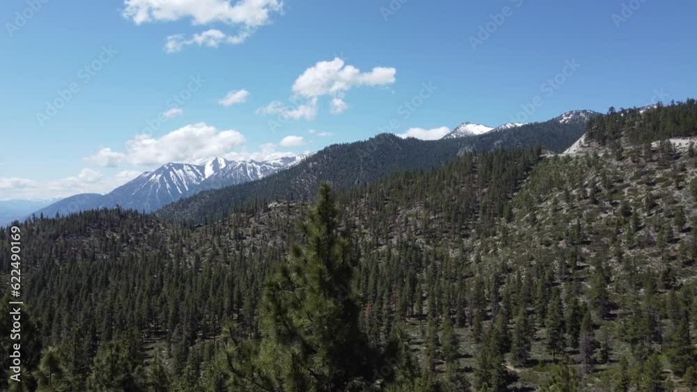 Panoramic Sunrise over Majestic Snow Capped Mountain Range in Sierra Nevada Lake Tahoe Nevada Natural Wilderness Dense Forest Panoramic Sunrise over Majestic Snow Capped Mountain Range in Sierra Nevada Lake Tahoe Nevada Natural Wilderness Dense Forest