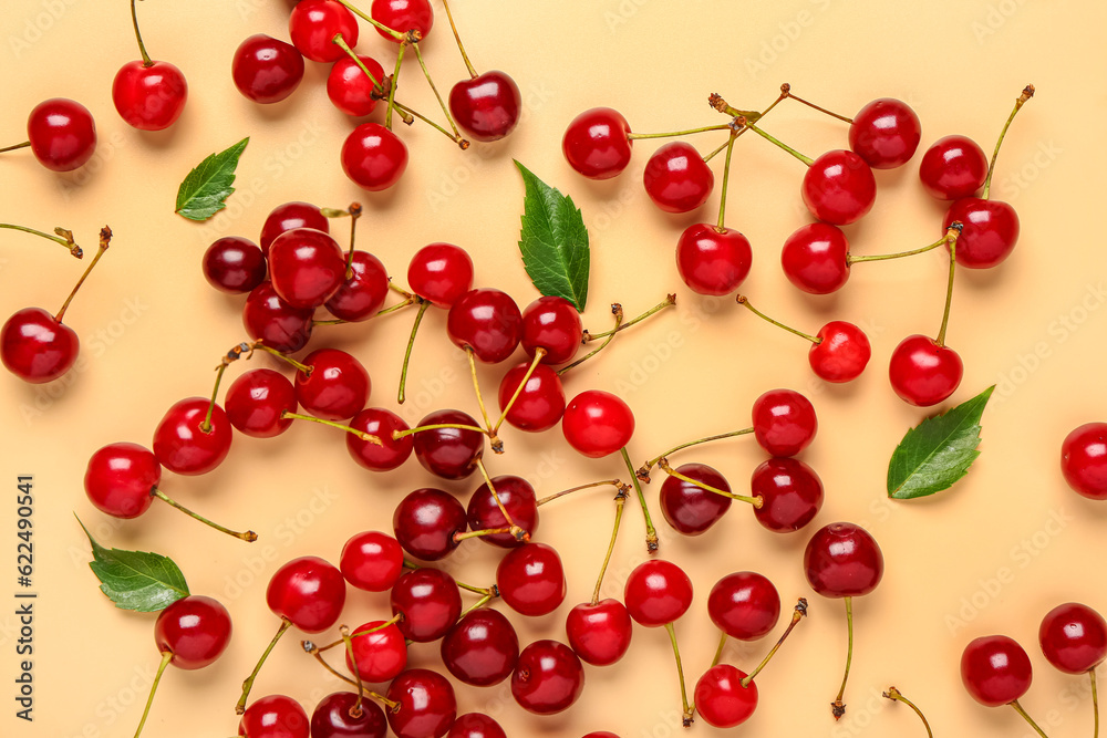Many red sweet cherries on orange background Many red sweet cherries on orange background