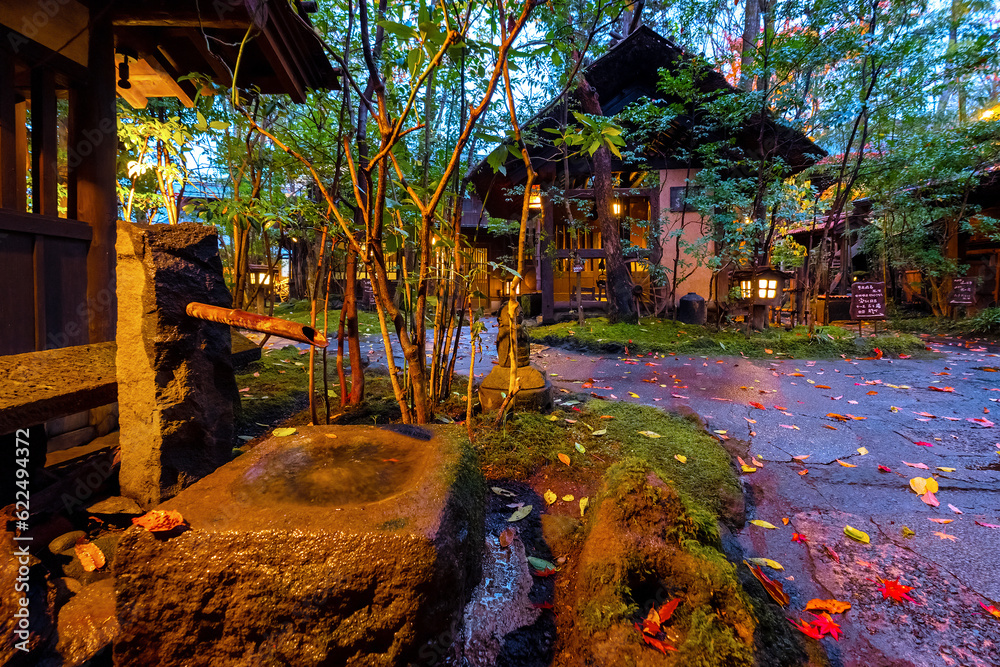 Kumamoto, Japan - Nov 23 2022: Kurokawa Onsen is one of Japan's most attractive hot spring towns. The town's lanes are lined by ryokan, public bath houses, attractive shops and cafes Kumamoto, Japan - Nov 23 2022: Kurokawa Onsen is one of Japan's most attractive hot spring towns. The town's lanes are lined by ryokan, public bath houses, attractive shops and cafes