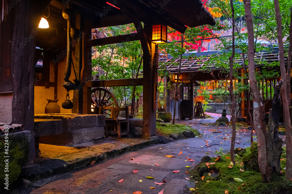 Kumamoto, Japan - Nov 23 2022: Kurokawa Onsen is one of Japan's most attractive hot spring towns. The town's lanes are lined by ryokan, public bath houses, attractive shops and cafes Kumamoto, Japan - Nov 23 2022: Kurokawa Onsen is one of Japan's most attractive hot spring towns. The town's lanes are lined by ryokan, public bath houses, attractive shops and cafes
