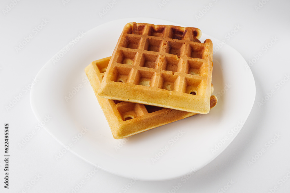 Two delicious Belgian waffles on white background Two delicious Belgian waffles on white background