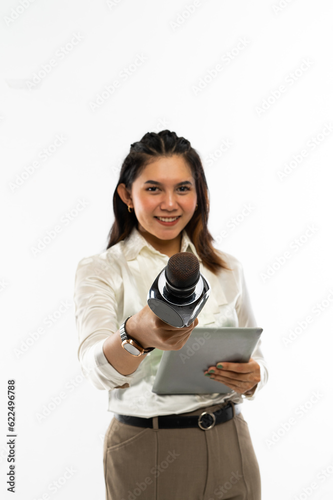 a beautiful journalist in white blouse standing with the tablet at her left hand and handed over a microphone a beautiful journalist in white blouse standing with the tablet at her left hand and handed over a microphone