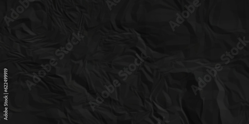 Black fabric texture and Crumpled black paper for background image. top view. black satin background 