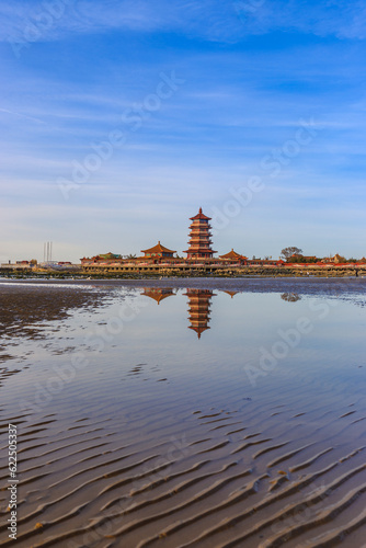 The Eight Immortals crossing the sea reflected in the sea water of Penglai Beach
