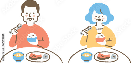 ご飯を食べている高齢の男女_色