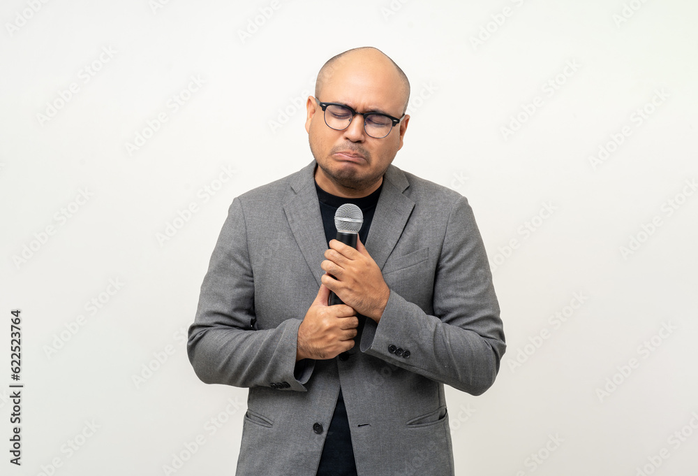 Businessman speaker with high quality dynamic microphone speaking talking with people on isolated white background. Male testing microphone voice for interview. Motivation life coach in training Businessman speaker with high quality dynamic microphone speaking talking with people on isolated white background. Male testing microphone voice for interview. Motivation life coach in training