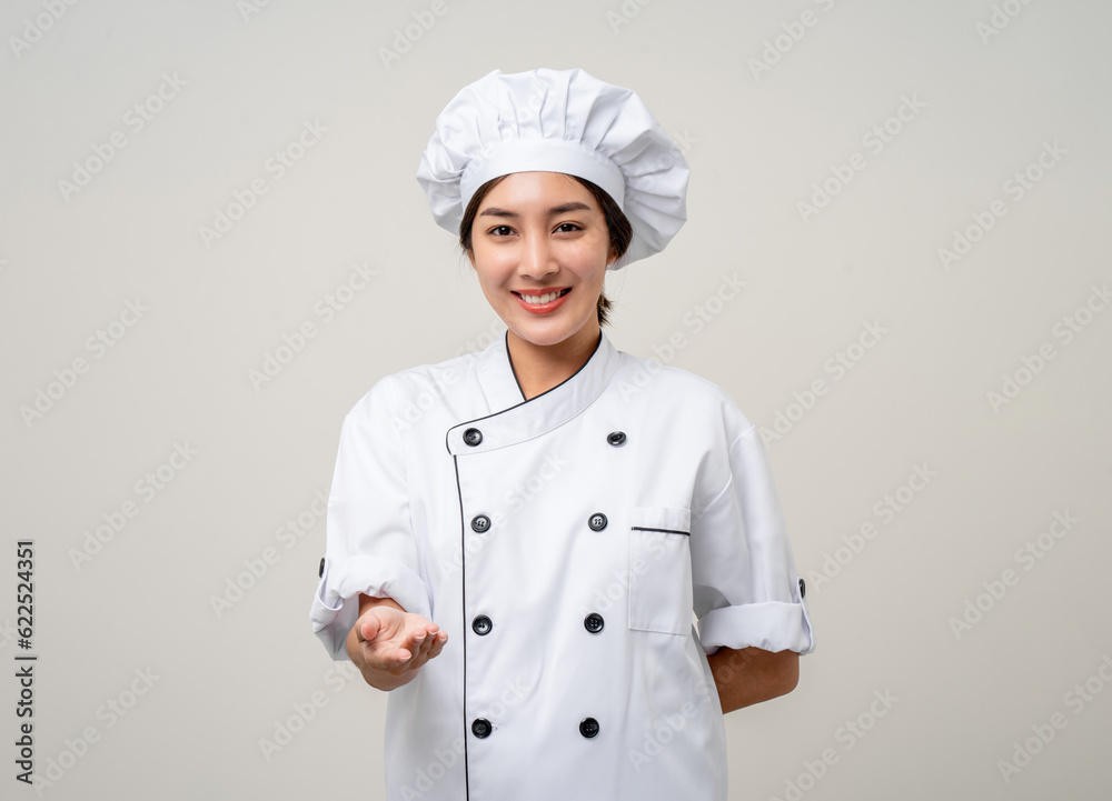 Smiling Young beautiful asian woman chef in uniform casual posing on isolated background. Cooking woman Occupation chef or baker People in kitchen restaurant and hotel.