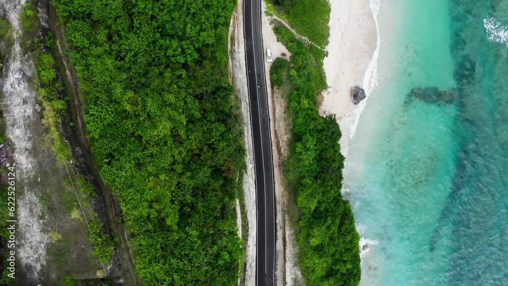 Tropical Island Bali Indonesia drone aerial shot birds eye view landscape nature coastline shore tourist travel Pandawa beach sea sunset. Tropical Island Bali Indonesia drone aerial shot birds eye view landscape nature coastline shore tourist travel Pandawa beach sea sunset.