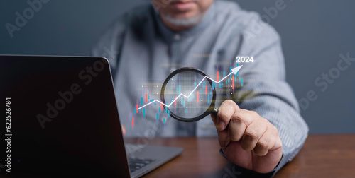 Business Stock Market Analysis Financial Growth and Investment Trends in 2024, Chart and Graph with Magnifying Glass Exploring Financial Data for Market Insights Investment Strategies Business Growth