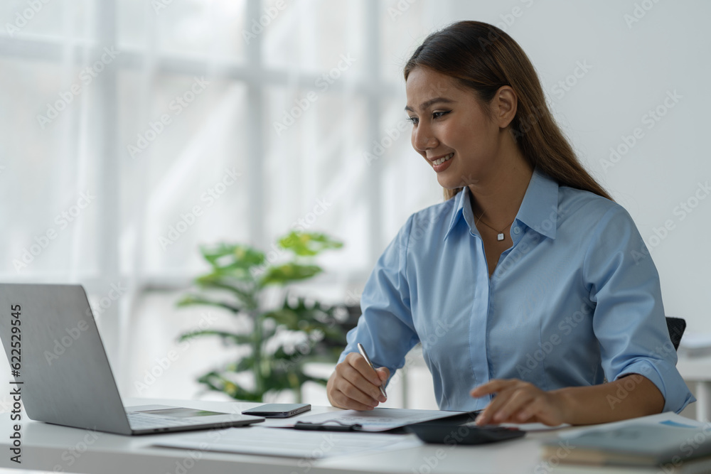 Businesswoman using calculator to check company finances income and budget Calculate monthly expenses, manage budgets, documents, loans, invoices, credits. Accounting concept, marketing Businesswoman using calculator to check company finances income and budget Calculate monthly expenses, manage budgets, documents, loans, invoices, credits. Accounting concept, marketing