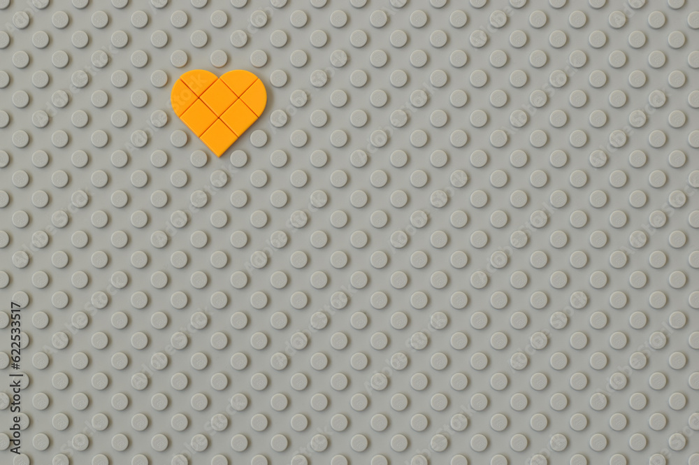 Fototapeta premium Lego gray baseplate with heart shape on round knots to assembly plastic bricks from popular toy brand. Editorial illustrative image of popular children plastic toy.