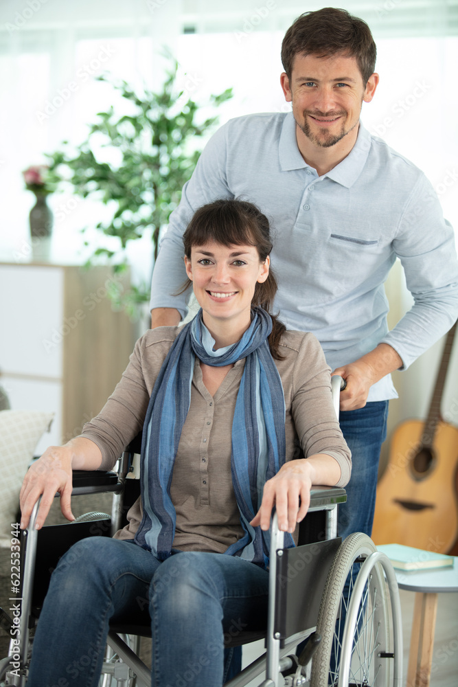 woman in wheelchair with handsome man woman in wheelchair with handsome man