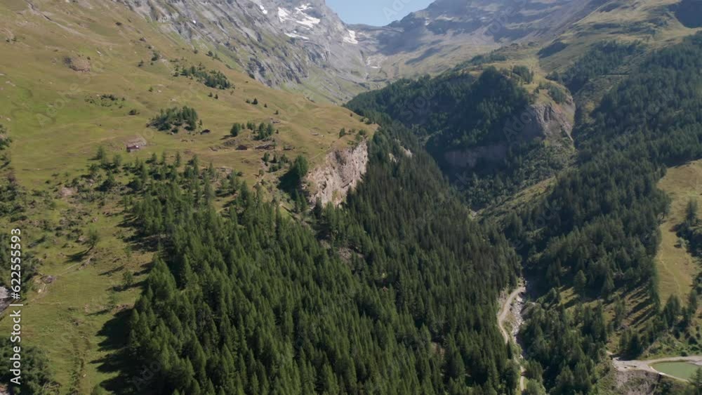 Aerial of beautiful valley with green forest in Swiss countryside Aerial of beautiful valley with green forest in Swiss countryside