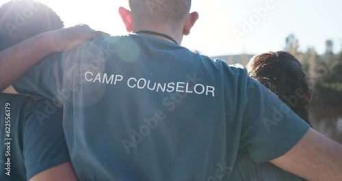 Camp counselor, group or people outdoor in nature for community service volunteer adventure in woods. Back of men and women at a lake and forest environment for camping, hike and freedom on travel