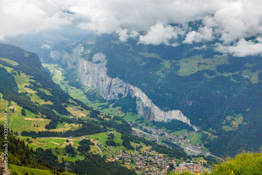 view from Männlichen through clouds into Lauterbrunnen valley