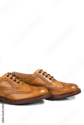 Pair of Tanned Brogue Derby Shoes of Calf Leather with Rubber Sole In One Line Over Pure White Background.