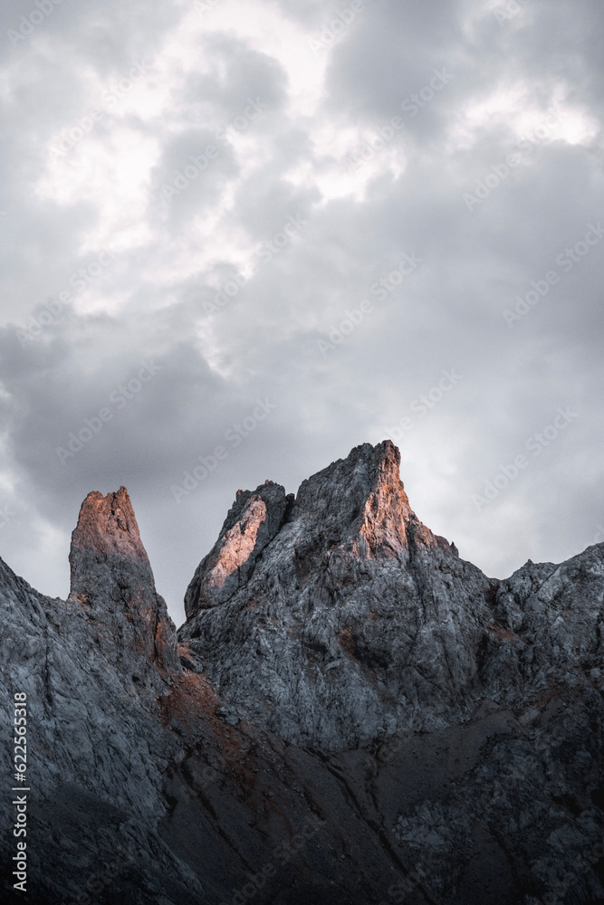 Rock needles illuminated by evening light near Naranjo de Bulnes or Urriellu in the Picos de Europa national park