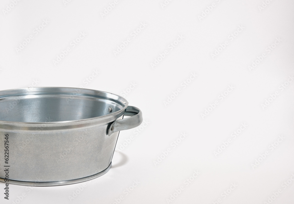 A metal basin isolated on white background. Copy space for text. A metal basin isolated on white background. Copy space for text.