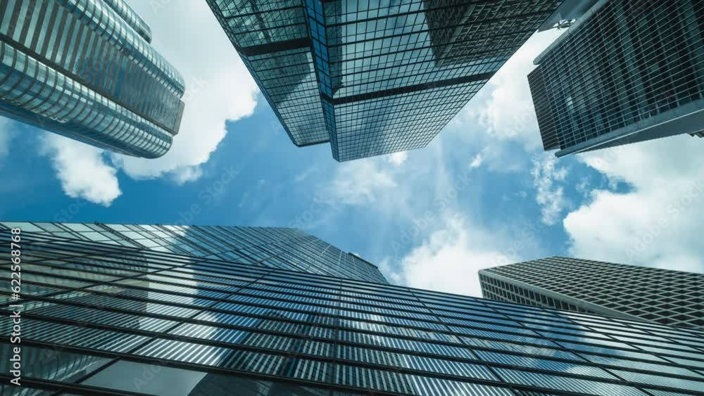 Time lapse of skyline commercial buildings and cloud sky.