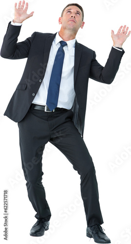 Digital png photo of focused caucasian businessman catching something on transparent background photo