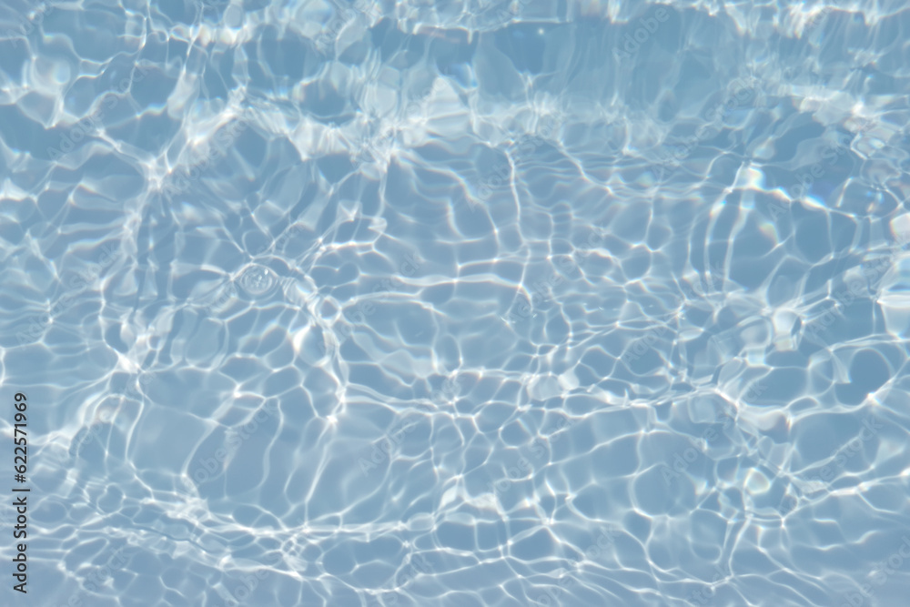Blue water with ripples on the surface. Defocus blurred transparent blue colored clear calm water surface texture with splashes and bubbles. Water waves with shining pattern texture background. Blue water with ripples on the surface. Defocus blurred transparent blue colored clear calm water surface texture with splashes and bubbles. Water waves with shining pattern texture background.