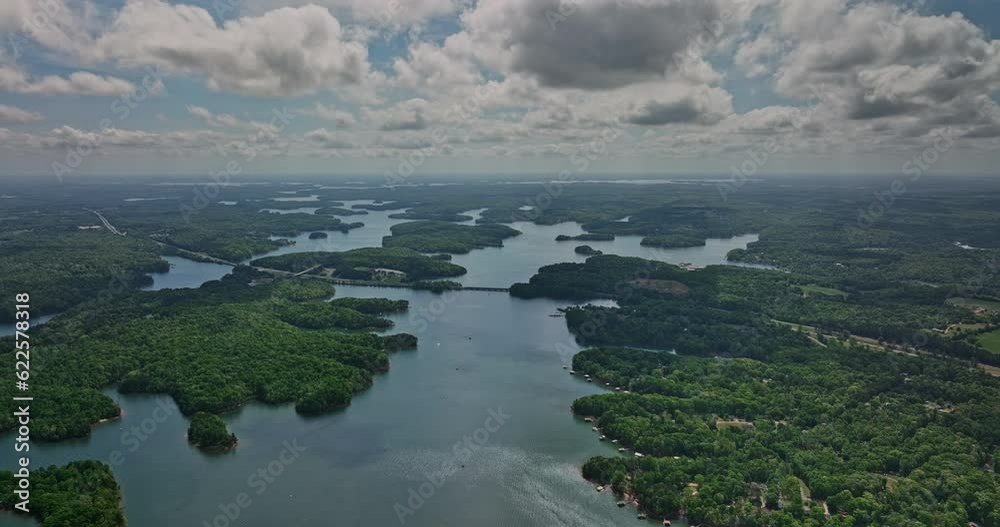 Lake Hartwell Georgia Aerial v5 drone flyover artificial man-made reservoir capturing lakeside homes and interstate highway route 85 running across the lake - Shot with Mavic 3 Cine - April 2022 Lake Hartwell Georgia Aerial v5 drone flyover artificial man-made reservoir capturing lakeside homes and interstate highway route 85 running across the lake - Shot with Mavic 3 Cine - April 2022