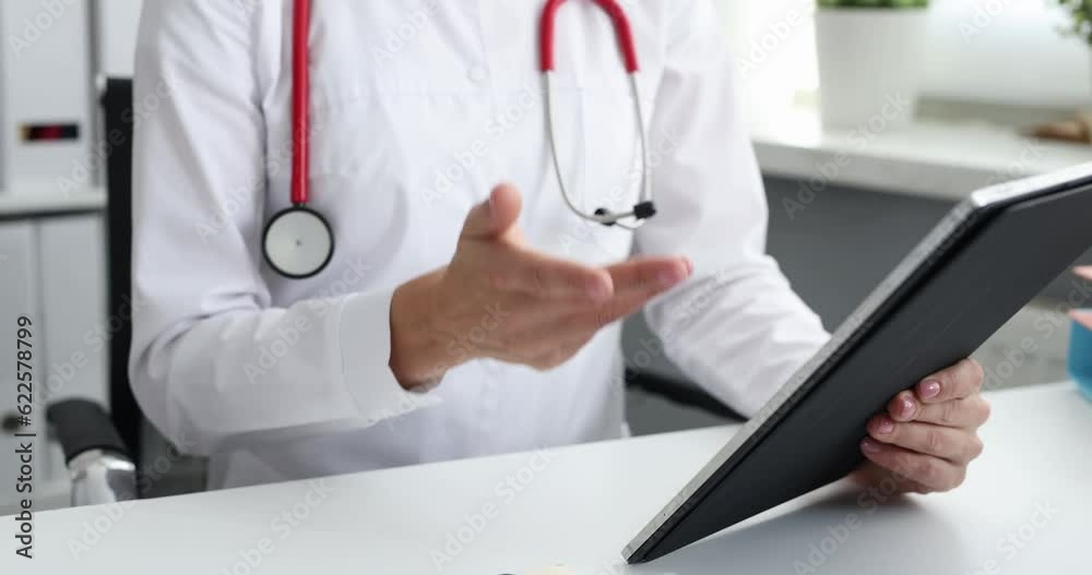 Doctor conducts medical consultation of sick patient via video call via tablet. Telemedicine concept Doctor conducts medical consultation of sick patient via video call via tablet. Telemedicine concept