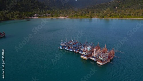 Best aerial top view flight
Boats anchoring in sea, island Ko Kut Ao Phrao beach, Thailand 2022. drone top down Above view
4K Cinematic. photo