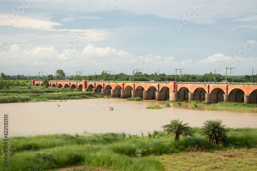 rail bridge over ajay river in the monsoon, west bengal photo