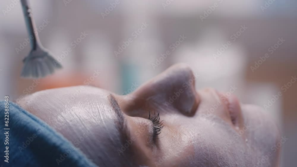 Close-up face of young female during professional facial treatment routine Close-up face of young female during professional facial treatment routine