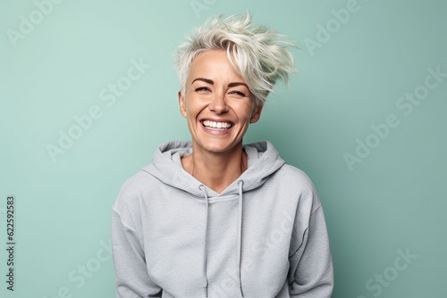 Portrait of a beautiful young woman with short blond hair smiling at the camera photo
