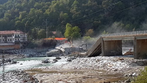 Collapsed bridge due to bad weather at Romagnano Sesia, Italy. Zoom out photo