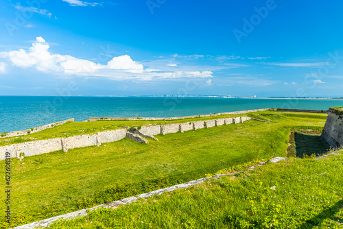 Old ruins of Fort la Prée and Ile de Ré bridge in La Flotte, France