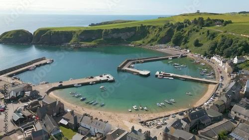 Aerial drone video of the port in the coastal town of Stonehaven, Scotland photo