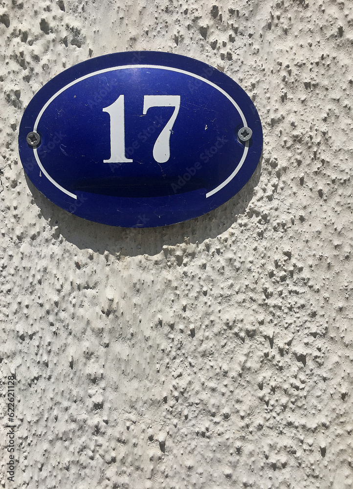 Close up of an house door number 17 Close up of an house door number 17