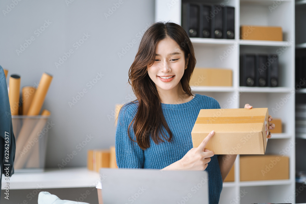 Asia vlogger woman influencer, SME retail store owner smile enjoy selling show live sale online screen smartphone and laptop work at home. Asia vlogger woman influencer, SME retail store owner smile enjoy selling show live sale online screen smartphone and laptop work at home.