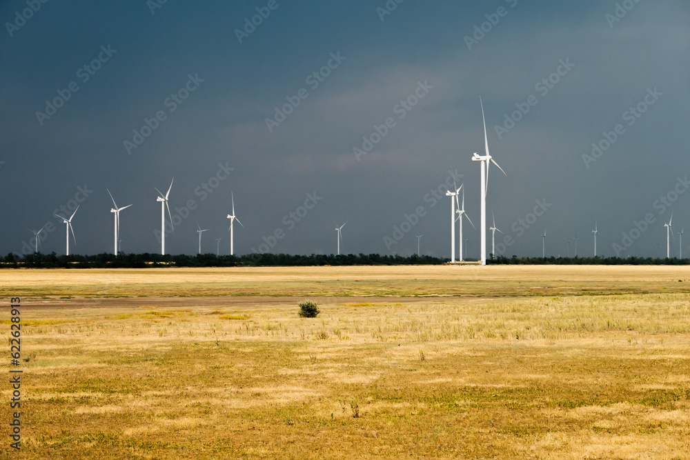 A wind farm or wind park, also called a wind power station or wind power plant A wind farm or wind park, also called a wind power station or wind power plant