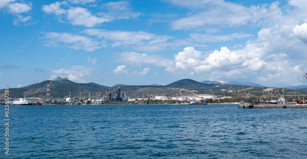 Elefsina Petroleum Oil Refinery known as Hellenic Energy, Attica Greece. wavy sea blue sky.