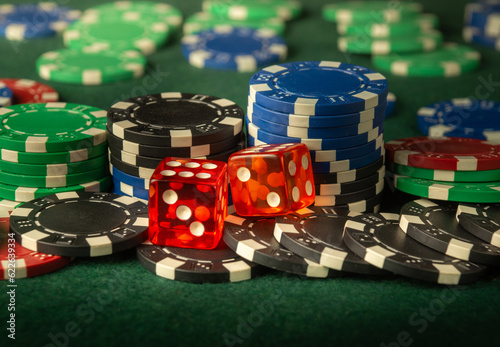 Dice game on the poker table in the club. A successful combination of dice brought a lot of winning chips.