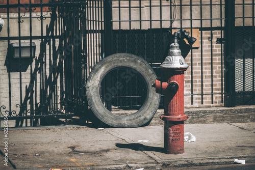 Red fire hydrant and tire, streets of New York