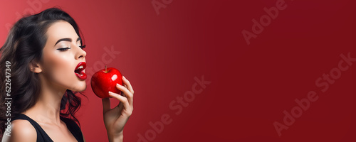 Beautiful young woman holding a red apple - symbolic of sin and temptation banner